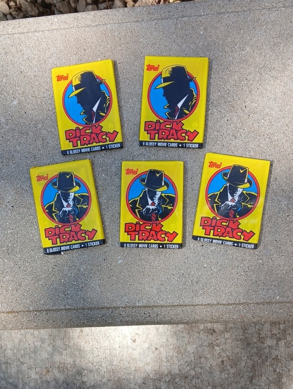five unopened packs of 1990 Topps Dick Tracy movie trading cards.